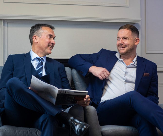 Alistair Jones, Russell Webb on sofa talking